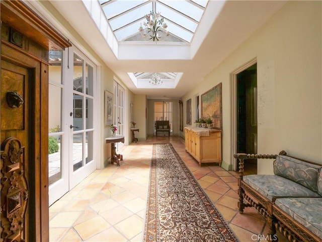 85 Vanderlip Dr, Rancho Palos Verdes, CA 90275 - sunroom with french doors, a skylight, and a notable chandelier