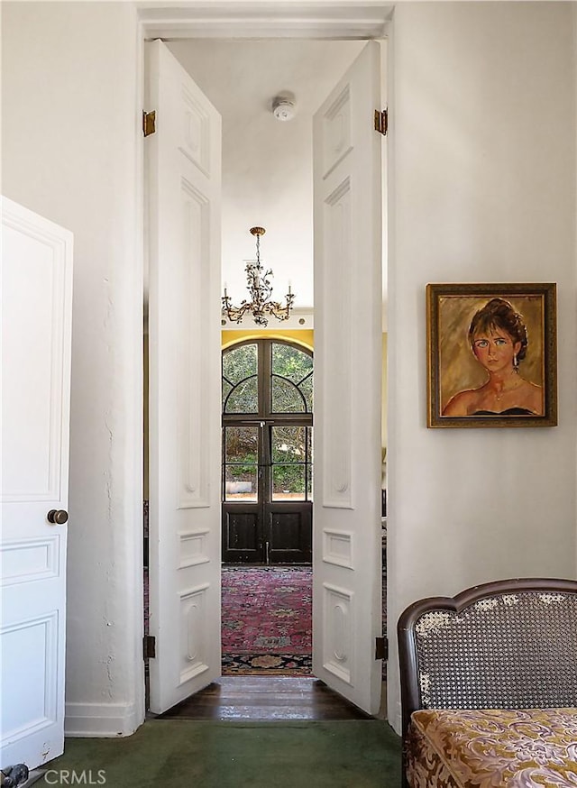 85 Vanderlip Dr, Rancho Palos Verdes, CA 90275 - hallway with dark wood-style floors, baseboards, and an inviting chandelier