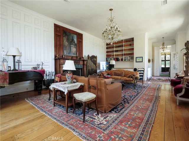 85 Vanderlip Dr, Rancho Palos Verdes, CA 90275 - living room with light wood-style floors, an inviting chandelier, and ornamental molding
