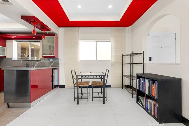 4301 Fulton Ave Unit 301, Sherman Oaks, CA 91423 - tiled dining area featuring a raised ceiling, arched walkways, and recessed lighting