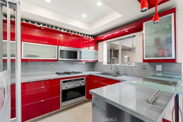 4301 Fulton Ave Unit 301, Sherman Oaks, CA 91423 - kitchen with appliances with stainless steel finishes, a sink, decorative backsplash, recessed lighting, and red cabinets