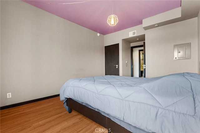 4301 Fulton Ave Unit 301, Sherman Oaks, CA 91423 - bedroom featuring electric panel, wood finished floors, and baseboards
