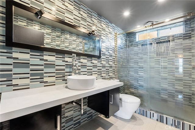 4301 Fulton Ave Unit 301, Sherman Oaks, CA 91423 - bathroom featuring a shower stall, toilet, tile walls, tile patterned flooring, and backsplash