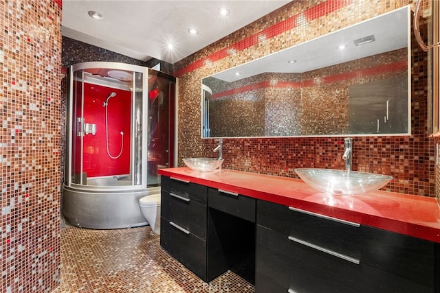 4301 Fulton Ave Unit 301, Sherman Oaks, CA 91423 - bathroom with tile walls, enclosed tub / shower combo, toilet, double vanity, and tile patterned floors