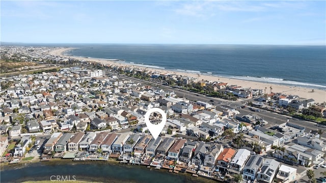 bird's eye view featuring a water view and a view of the beach