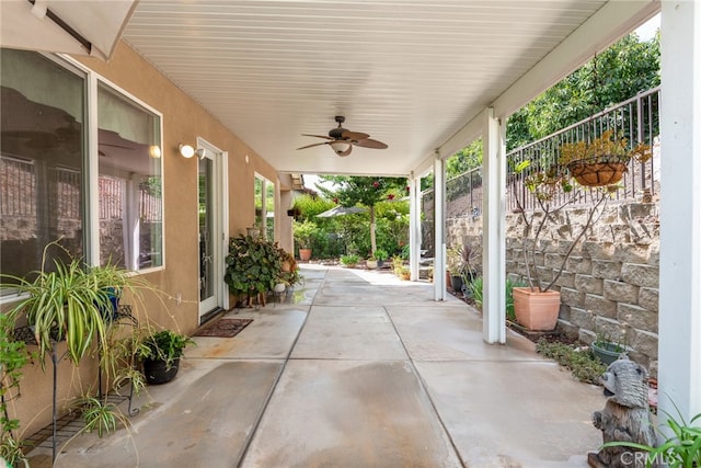 view of patio featuring ceiling fan