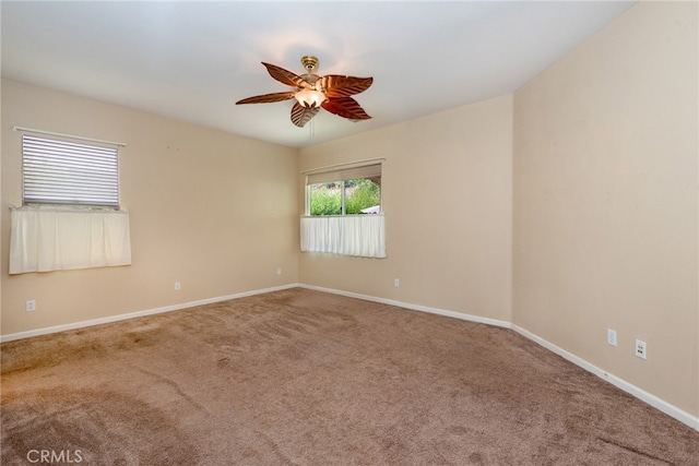 unfurnished room featuring carpet and ceiling fan