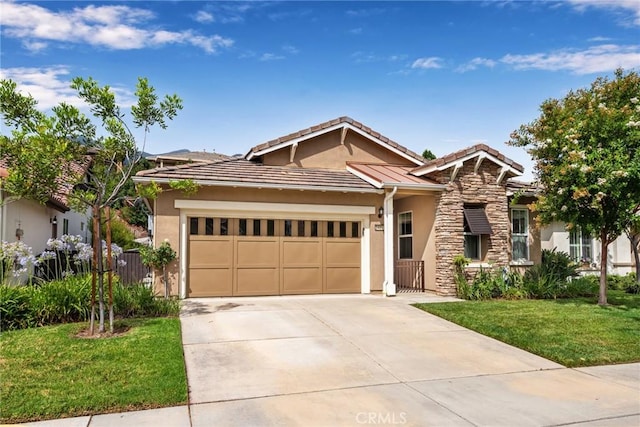 view of front of house featuring a garage and a front yard