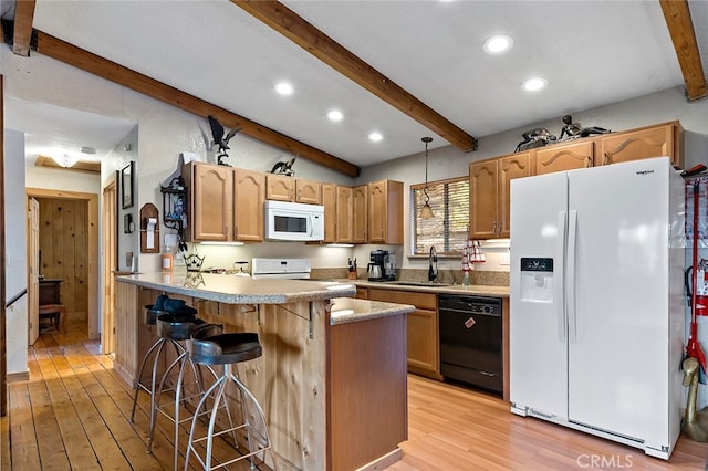 kitchen featuring light hardwood / wood-style floors, sink, a kitchen breakfast bar, white appliances, and vaulted ceiling with beams