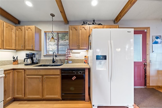 kitchen with pendant lighting, black dishwasher, beamed ceiling, white refrigerator with ice dispenser, and sink