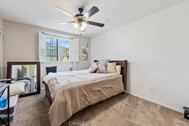 bedroom with ceiling fan and carpet floors