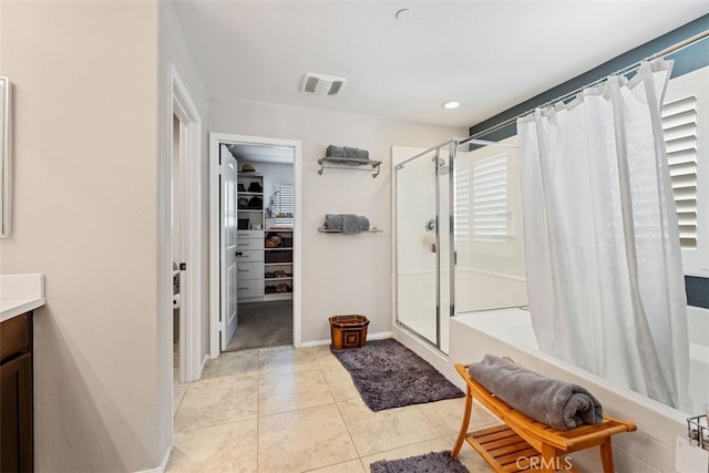 bathroom with tile patterned floors, vanity, and curtained shower