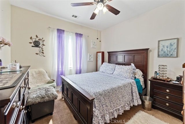 bedroom with ceiling fan and light colored carpet