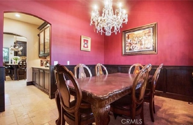 dining area featuring an inviting chandelier