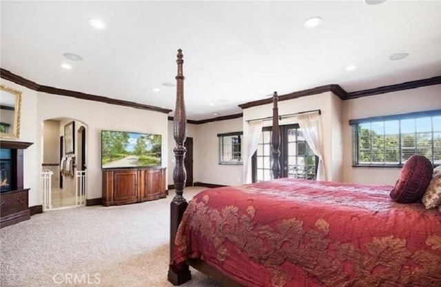 carpeted bedroom with ornamental molding