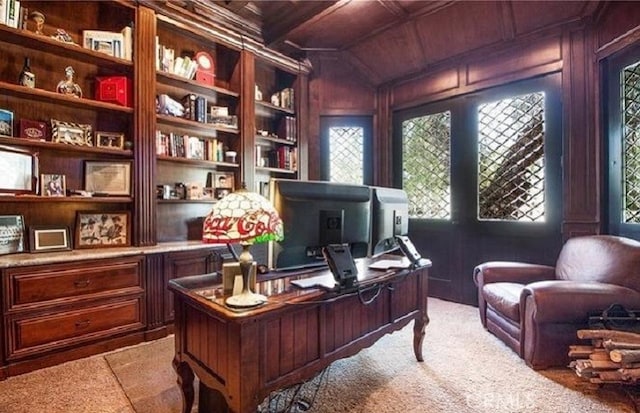 office featuring wooden walls, vaulted ceiling, built in shelves, and wooden ceiling