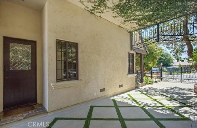 view of side of property featuring a patio area