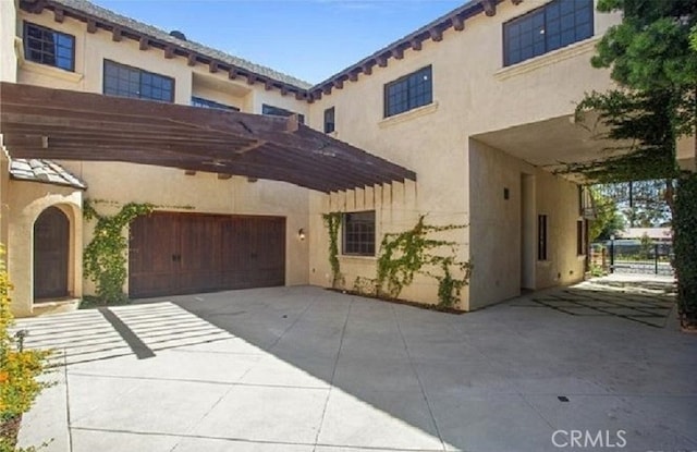 mediterranean / spanish house with a garage