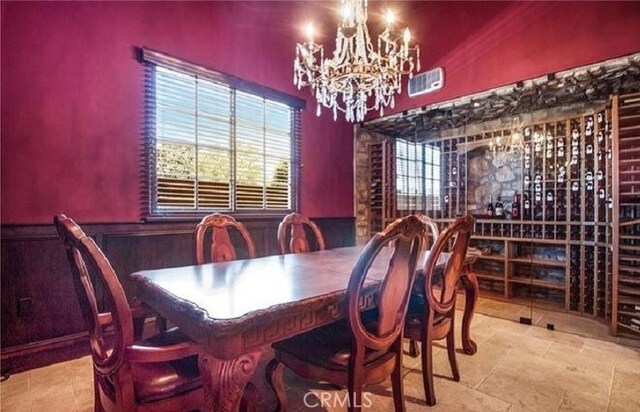 dining space featuring a notable chandelier