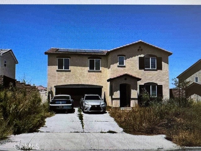 view of front of home with a garage