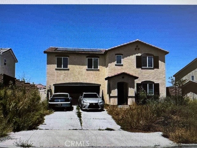 32198 Rambling Ct, Winchester, CA 92596 - view of front of property with an attached garage, solar panels, and driveway