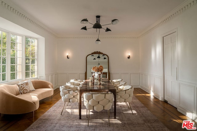 dining space featuring ornamental molding and dark hardwood / wood-style floors