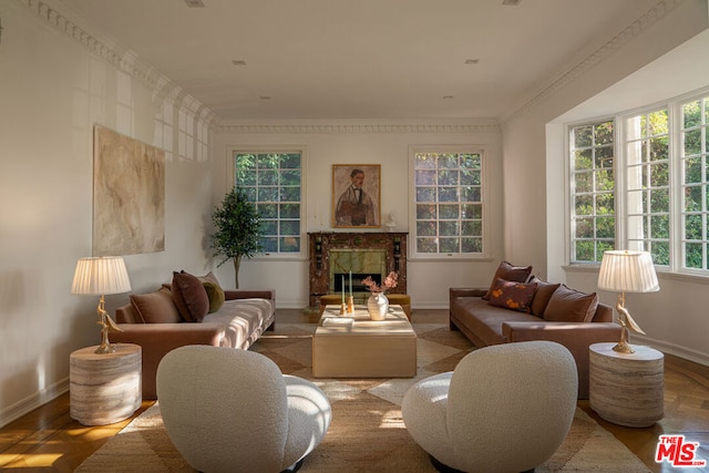 living room with ornamental molding and parquet flooring