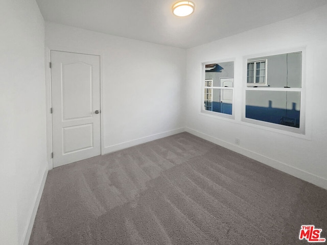 spare room featuring carpet floors