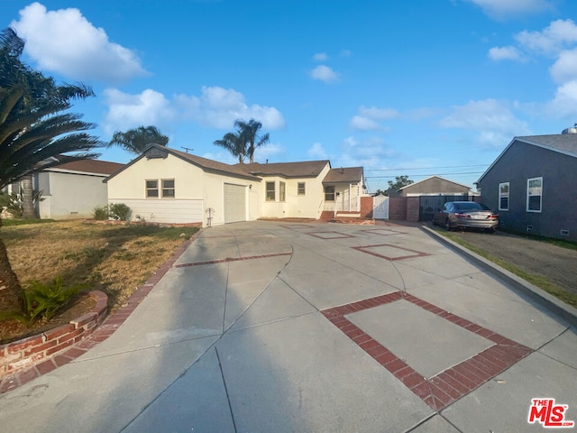 view of front facade with a garage and a front lawn