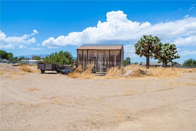 view of outbuilding with a rural view