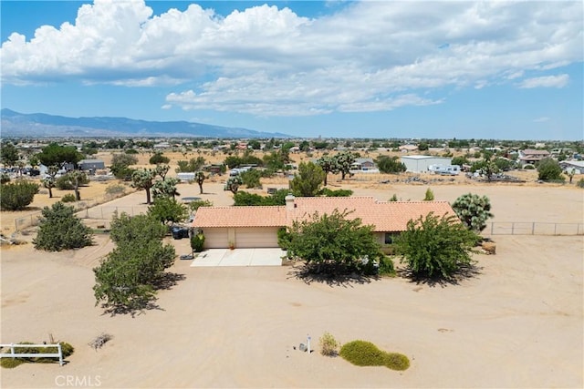 birds eye view of property featuring a mountain view