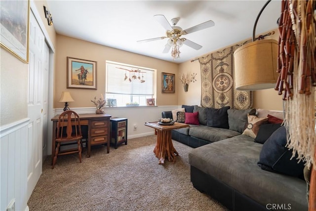 carpeted living room featuring ceiling fan