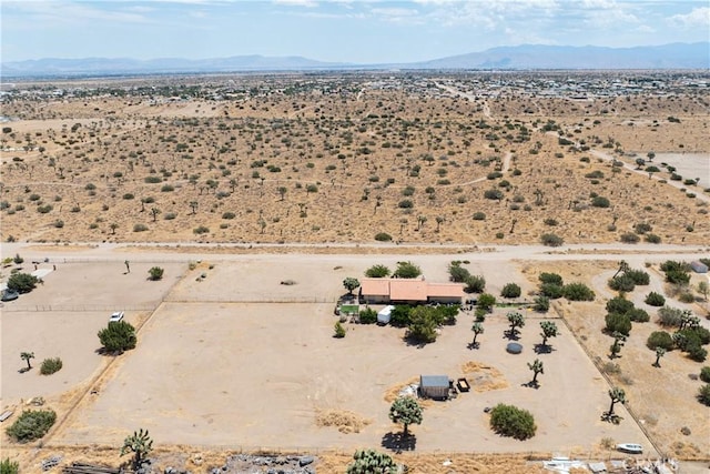 birds eye view of property with a mountain view