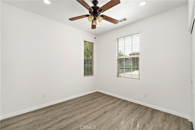 unfurnished room featuring light hardwood / wood-style floors and ceiling fan