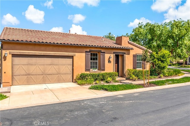 mediterranean / spanish-style house featuring a garage