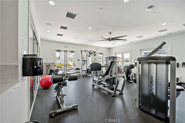 gym with a wealth of natural light and ceiling fan