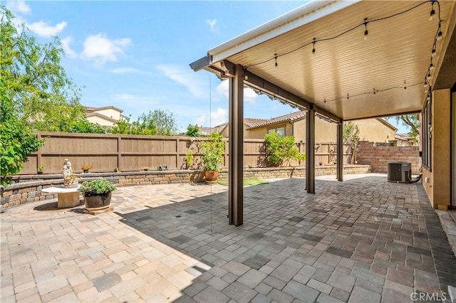 view of patio with central AC