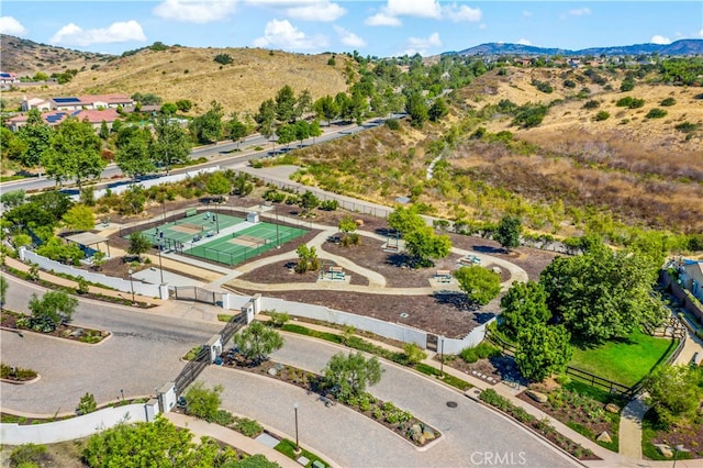 birds eye view of property with a mountain view