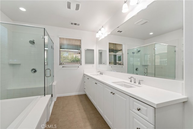 bathroom with vanity, independent shower and bath, and tile patterned flooring