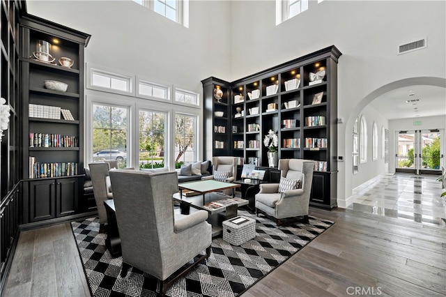 home office featuring dark wood-type flooring and a healthy amount of sunlight