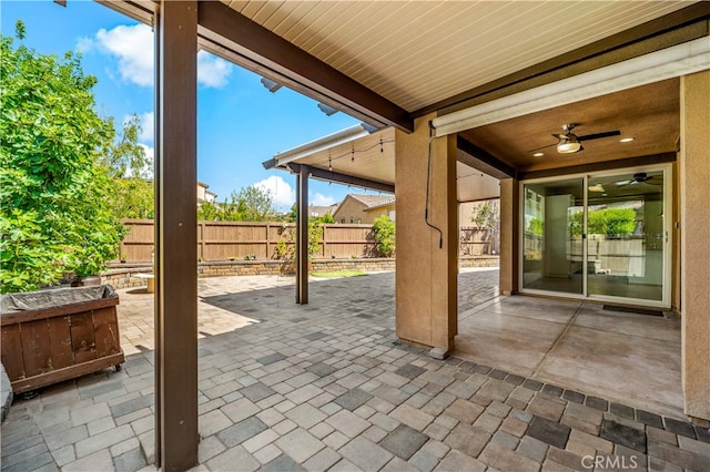 view of patio featuring ceiling fan