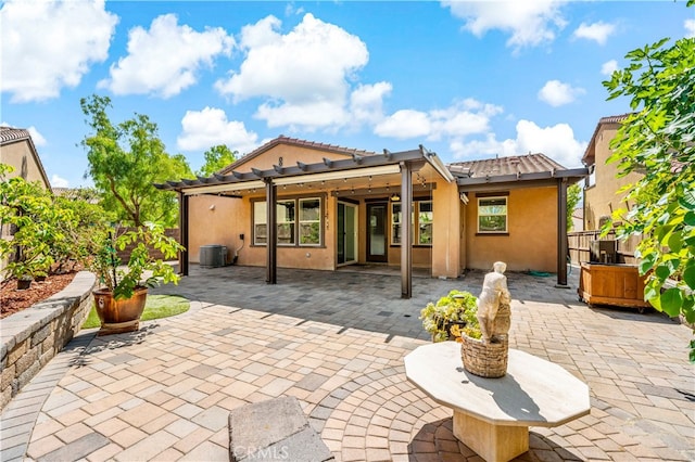 back of property with a patio, a pergola, and cooling unit