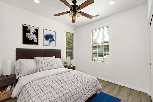 bedroom featuring hardwood / wood-style floors and ceiling fan