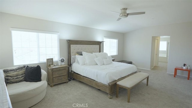 bedroom with ceiling fan and light carpet