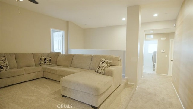 living room with ceiling fan and light carpet