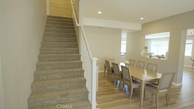 staircase with hardwood / wood-style floors