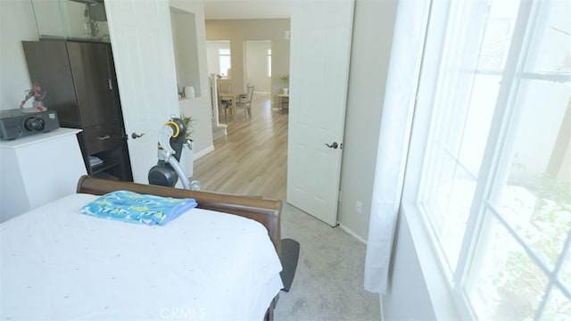 bedroom with light hardwood / wood-style flooring