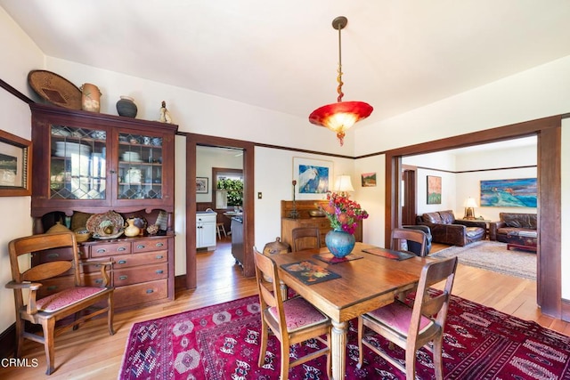 dining area with light hardwood / wood-style flooring