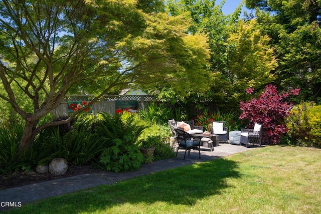 view of yard with an outdoor living space and a patio