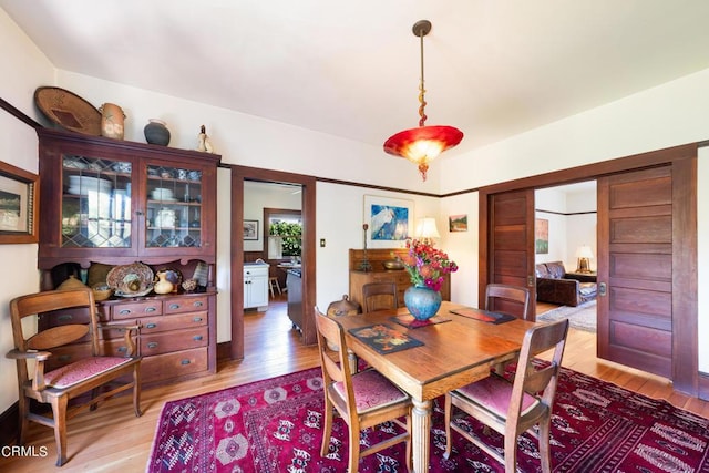 dining space featuring light hardwood / wood-style floors